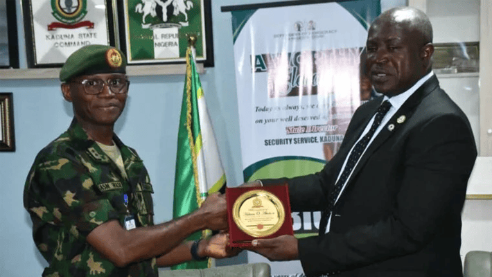 Abubakar Wase presenting certificate