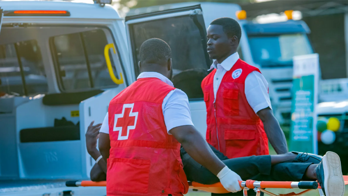 Healthcare workers by an ambulance used to illustrate the story