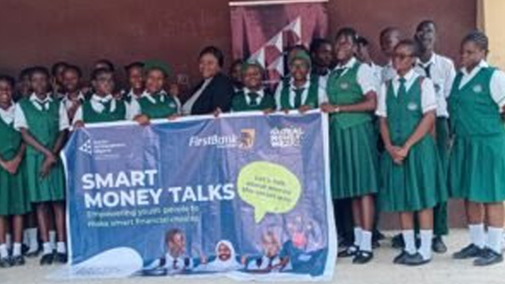 Afolake Oredola flanked by students of ISL