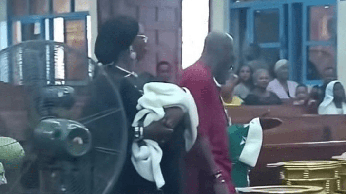 Tuface and wife with the baby during the dedication 