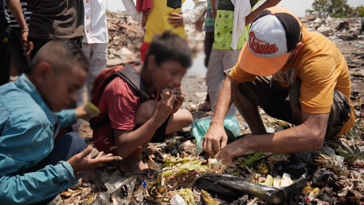 Venezuelans searching for food in waste bins