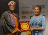 Otunba Yemisi Shillon presenting the Outstanding Institutional Recognition Award to the Representative of the DG NCC