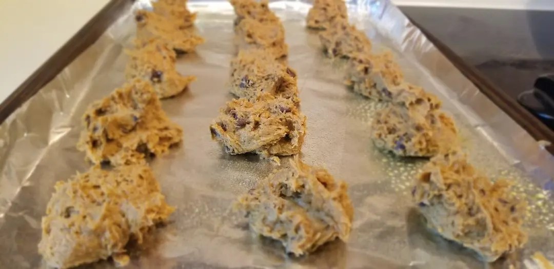 Easiest Pumpkin Chocolate Chip Cookies with only 3 Ingredients. These soft and chewy cookies are made with cake mix and could not be easier. Perfect for Thanksgiving and Halloween parties. #pumpkin #pumpkincookies #fall #3indredients #cookies #thanksgiving #halloween #cakemix 