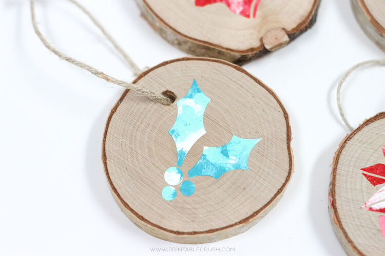Make your tree shine with these DIY Christmas Ornaments made using the Cricut! So many easy ornament ideas to help you deck your halls—using your Cricut or other electronic cutting machine!