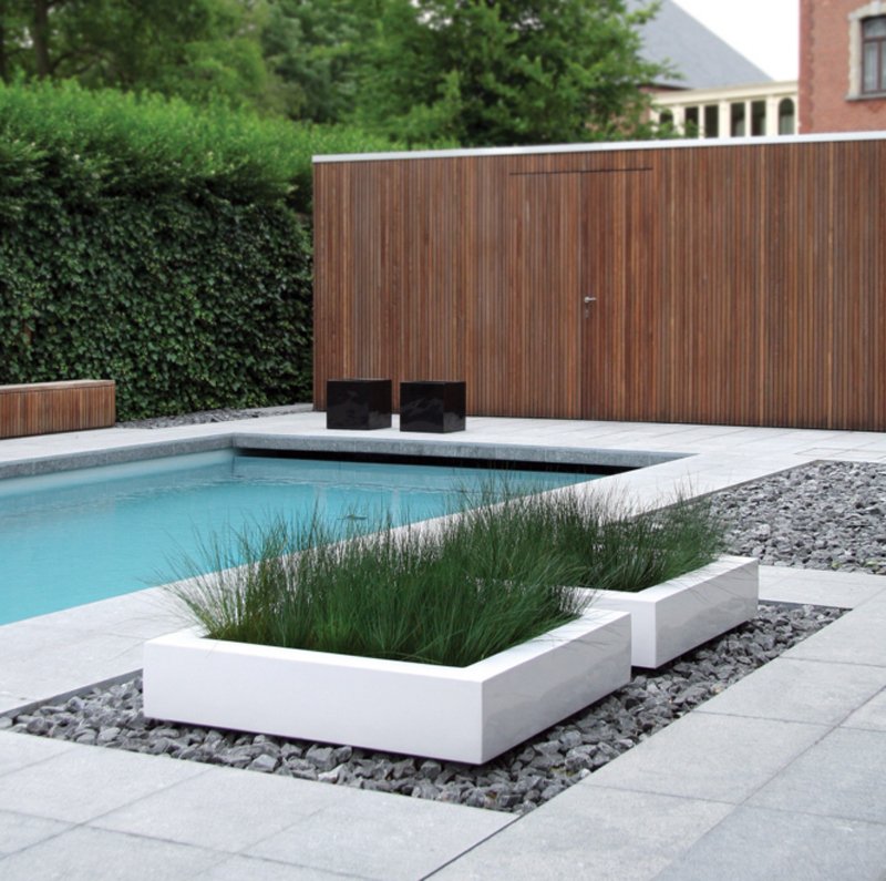 Tall slate gray lightweight concrete round outdoor bowl planter. 20 Gorgeous Planters by the Swimming Pool | Home Design Lover