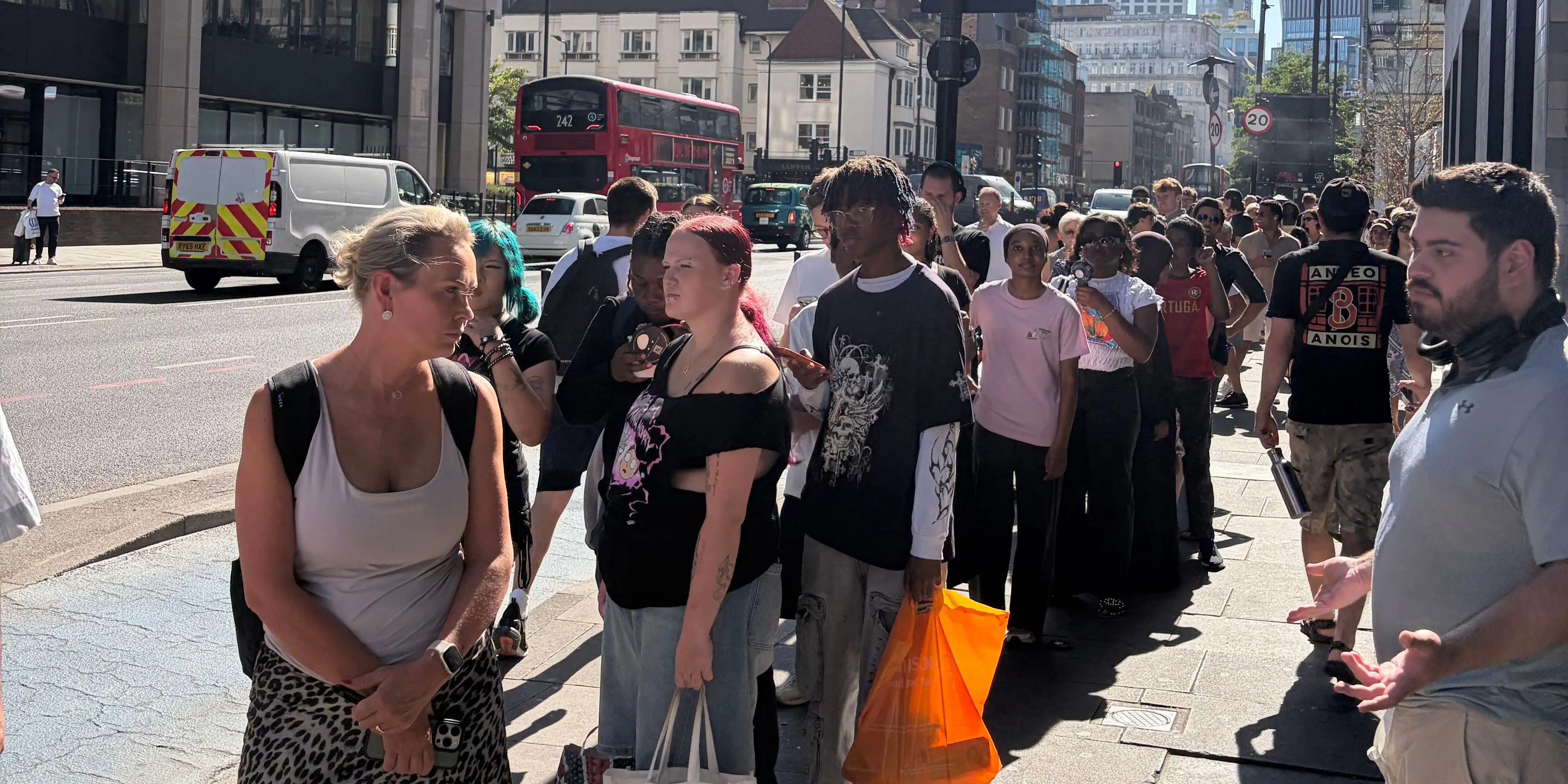 The hottest thing to do in London today is wait in line for solar eclipse glasses