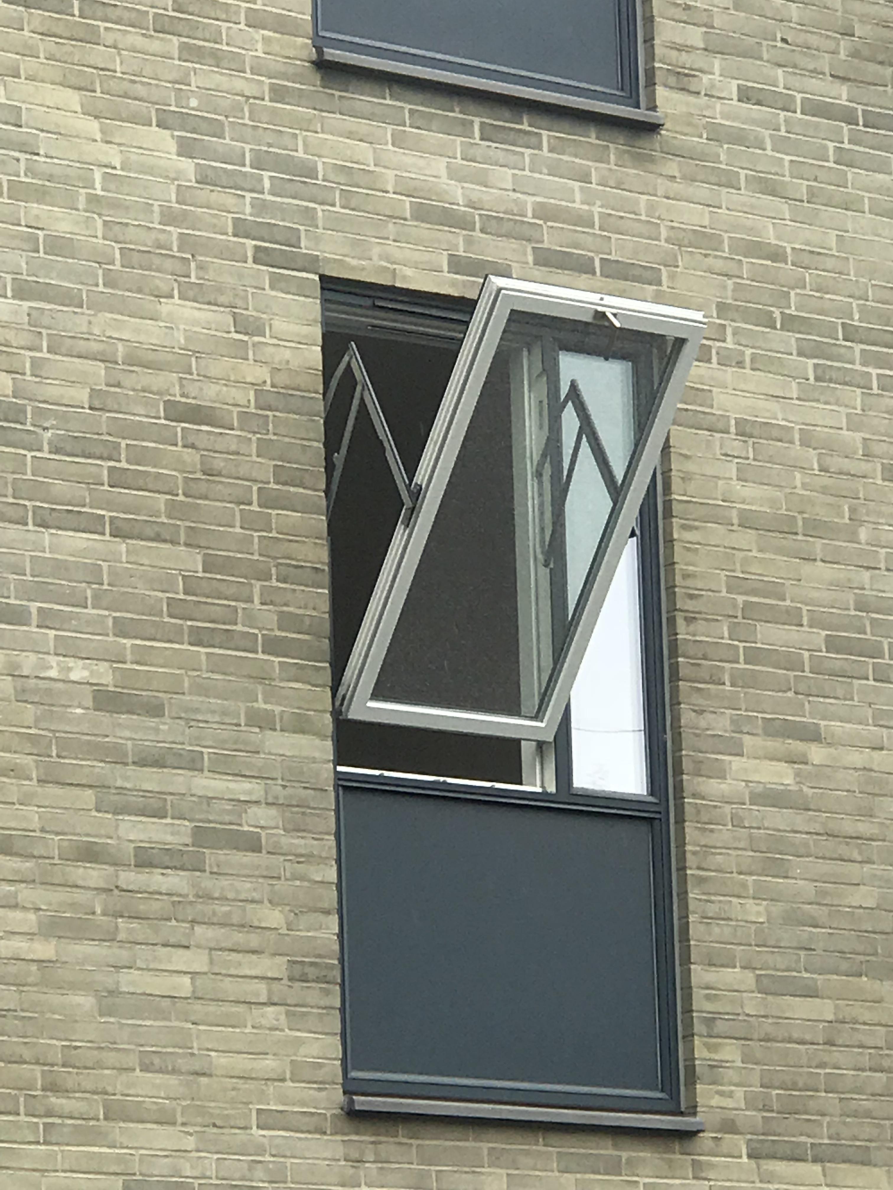 Window blinds add a lot of character to a room. This apartment window designed with an upside down opening