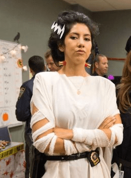 In Brooklyn Nine Nine Season 1 Episode 6 Halloween Rosa Diaz Is Wearing A Bride Of Frankenstein Costume Where The Nails On Her Neck Are Cut Off Shotgun Slugs Seeing As Everyone Had