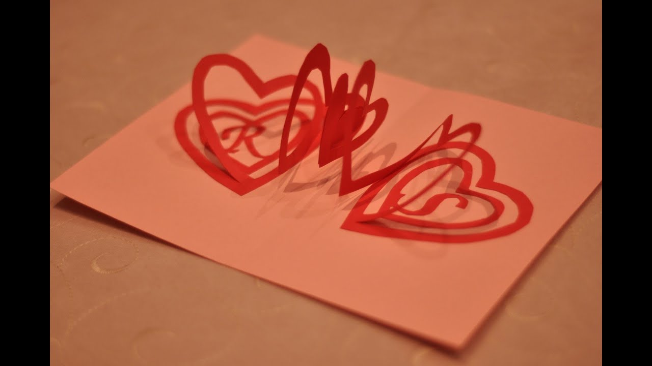 Line up and place another heart half on the glue to attach them . How to make a Valentine's Day Pop Up Card: Spiral Heart - YouTube