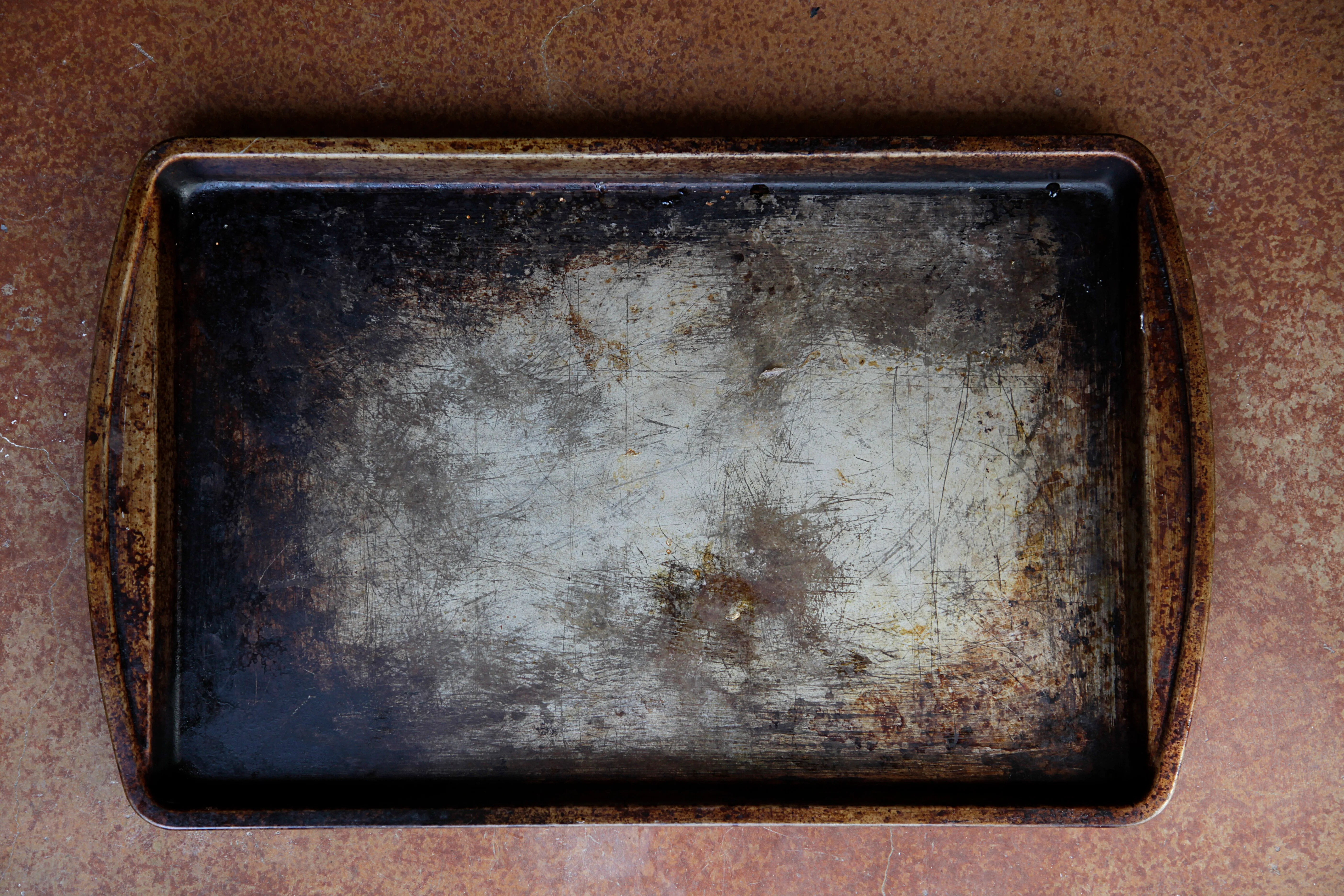 The Secret To Sparkling Baking Trays Is Hiding In Your Food Cupboard