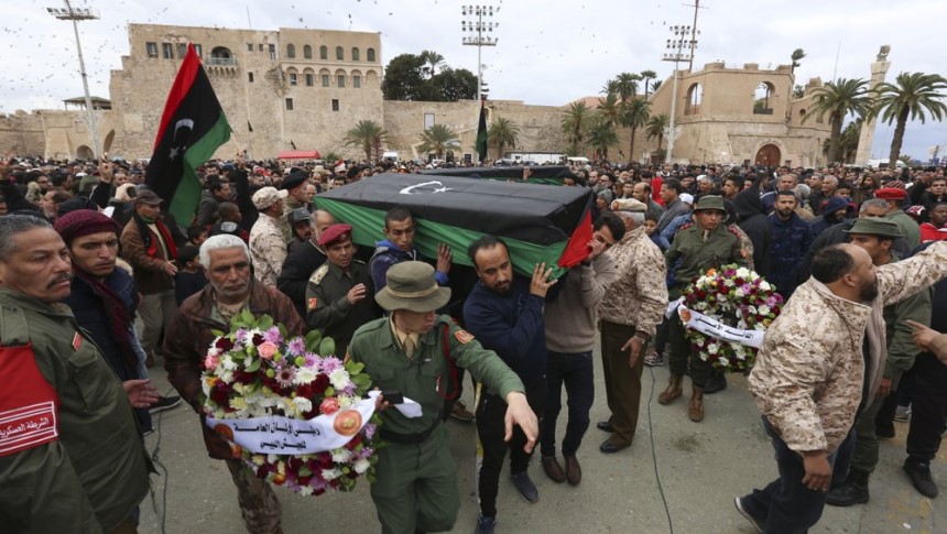 Mourners carry coffins during a funeral of military cadets in Tripoli, Libya, Sunday, Jan. 5, 2020.