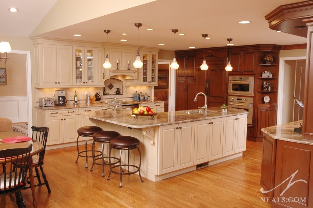 Factors to consider when deciding to reface kitchen cabinets, including types of veneer, such as wood and plastic laminate. Mixing Cabinet Colors in the Kitchen
