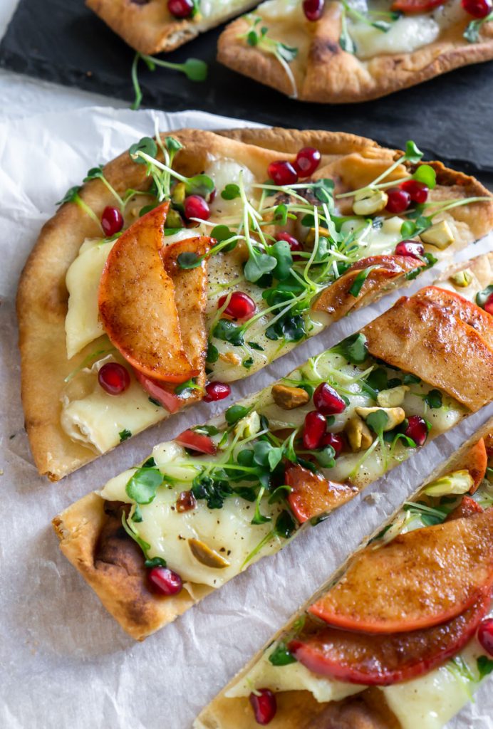 flatbread pizza sliced on parchment paper