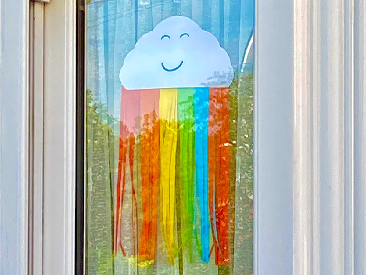 This is a smiling sleeping cloud with rainbow colours streaming out of the bottom of it