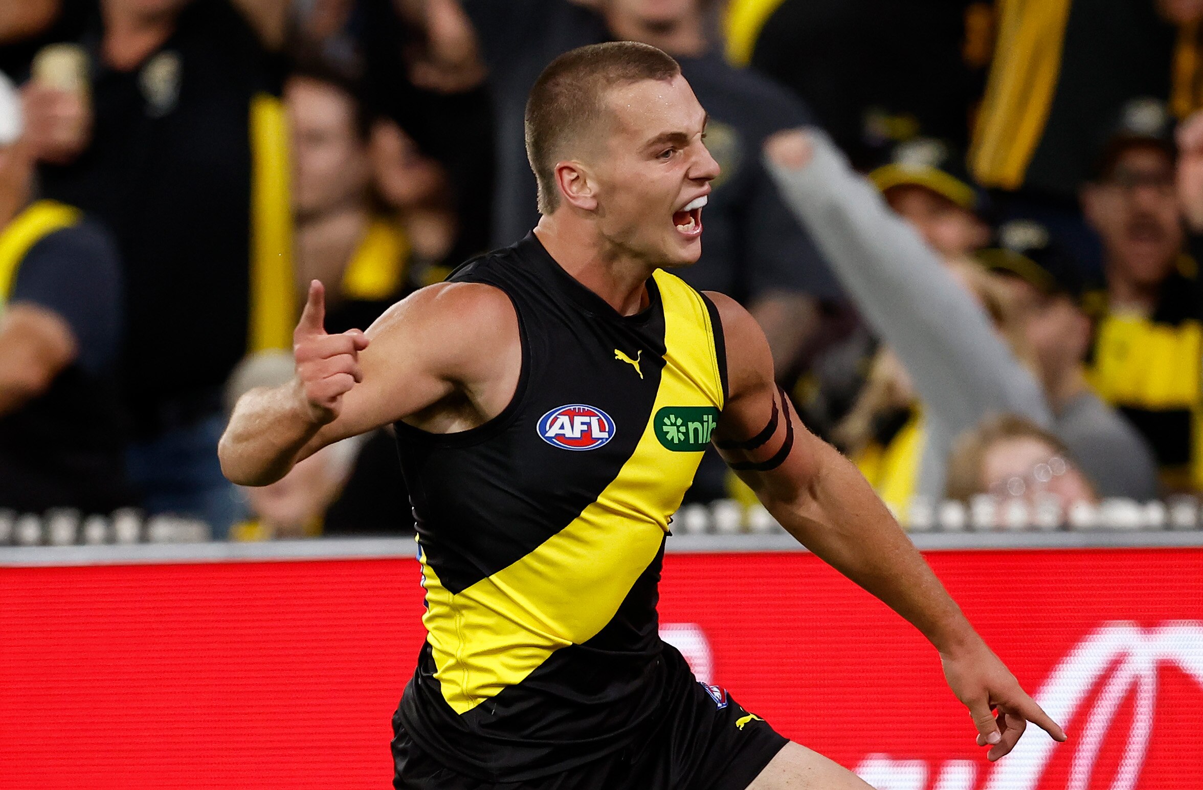 Tigers defeat Blues by 13 points as Sam Lalor produces stunning AFL debut at MCG