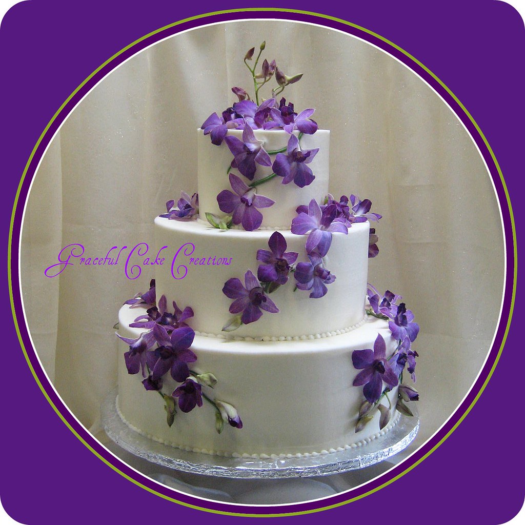 Once you've vowed to spend forever with your beloved, vow to spend the rest of the night celebrating by chowing down. Ivory Wedding Cake With Purple Orchids A Photo On Flickriver