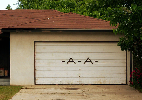 The process of programming a universal garage door remote varies according to the make and model of the device. Mid-Century Modern Garage Door | Modesto, CA | J.L. Ordaz | Flickr