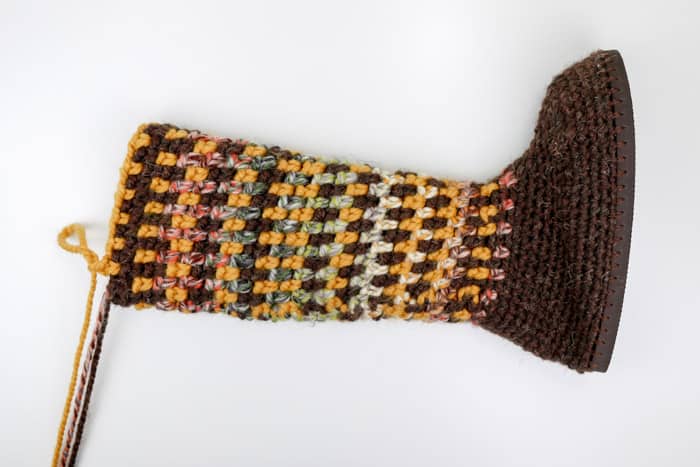 So, checkout here one more sample, crocheted in green and comes with an accent yellow and white dotted line at the ankle! Mukluk Crochet Slipper Boots With Flip Flop Soles Free Pattern