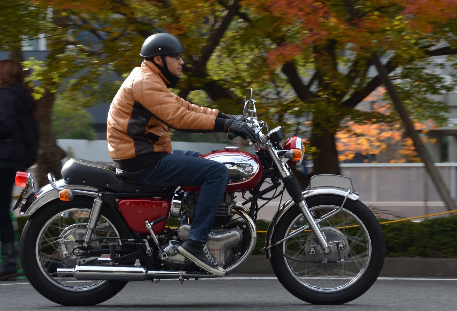 A vintage-inspired chopper at the Yokohama Hot Rod Custom Show, its gleaming chrome and elongated frame a testament to classic customization.