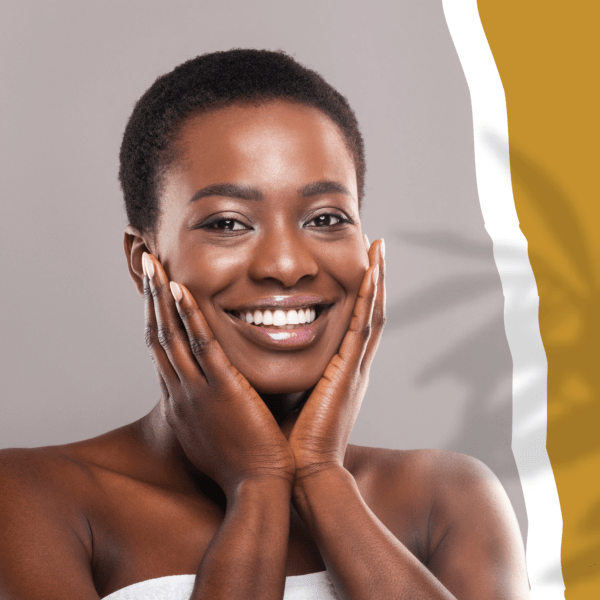 Woman touching her face and smiling after receiving a Facial Treatment at the Spa.