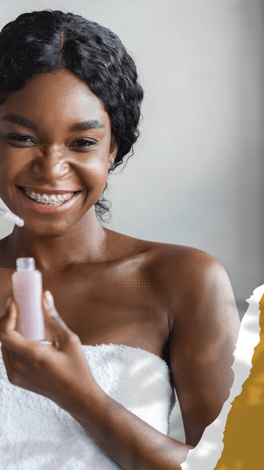 Girl with dark hair and bracers smiling as she gets ready for her Spa services.