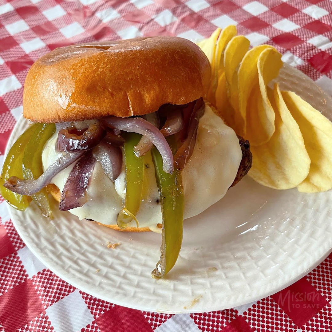 philly cheeseburger on plate