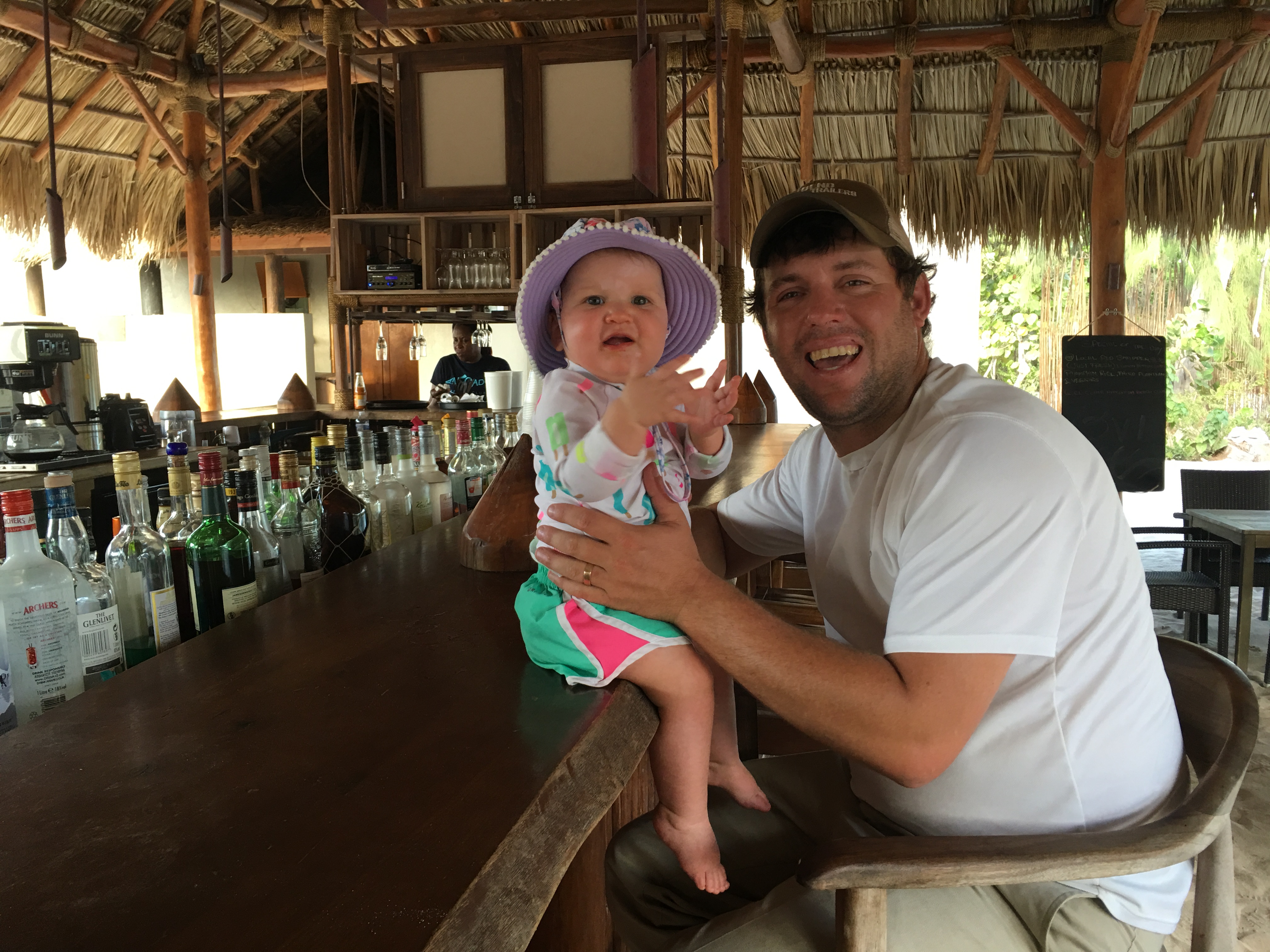 Taylor and Charlotte sitting at a bar in Anegada, BVI