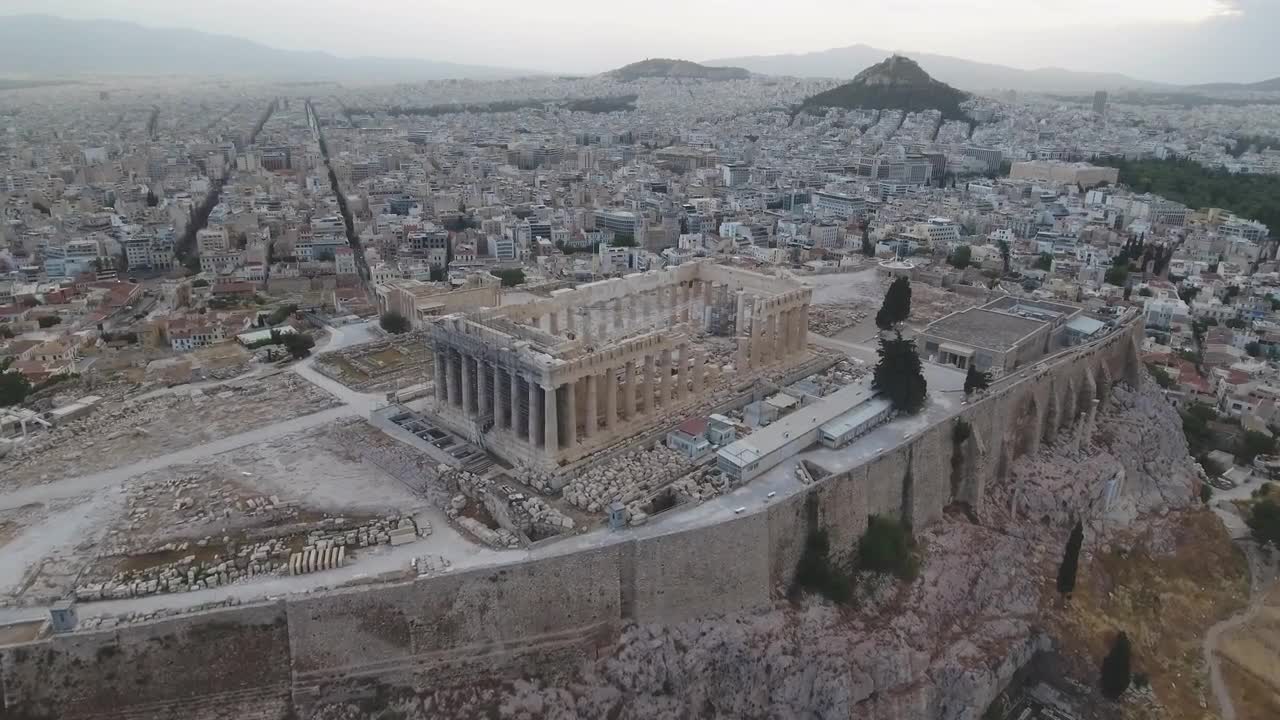 The parthenon · the parthenon is an ancient greek temple built on the acropolis hill of athens, greece. Aerial View Of Acropolis In Athens Stock Video Motion Array