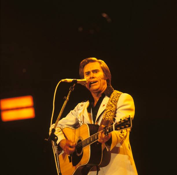 George Jones performs on stage at the Country Music Festival held at Wembley Arena, London, United Kingdom on April 01, 1981.
Photo Credit: David Redfern/Redferns