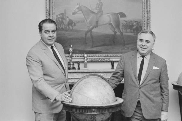 American film producer Albert R Broccoli (1909-1996) pictured on left with Canadian co-producer Harry Saltzman (1915-1994) in London in February 1966. 

Photo Credit: Popperfoto via Getty Images