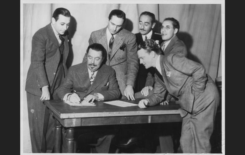 Stars join the Screen Actors Guild in 1933. (L to R) George Raft, Warner Oland, Frederic March, Adolphe Menjou, Groucho Marx, and James Cagney.

Photo Credit: SAG/AFTRA