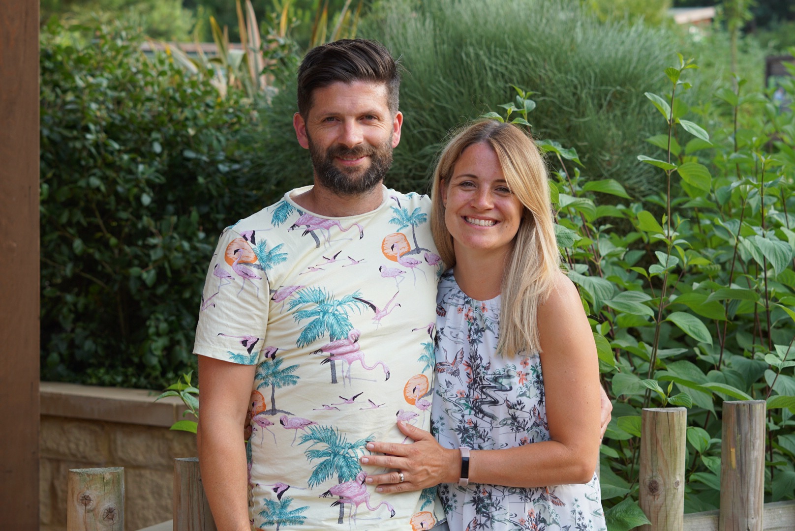 2 People Sitting With View of Yellow Flowers during Daytime