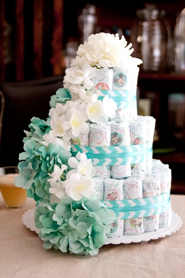 Diaper cakes are usually used as centerpieces for baby showers and gifts for expectant moms. Diaper Cake and Ponche a la Romana - Muy Bueno Cookbook