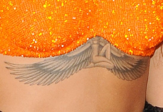 Rihanna's Tattoos And What They Mean - [2021 Celebrity Ink Guide] 375_x_546_jpg
