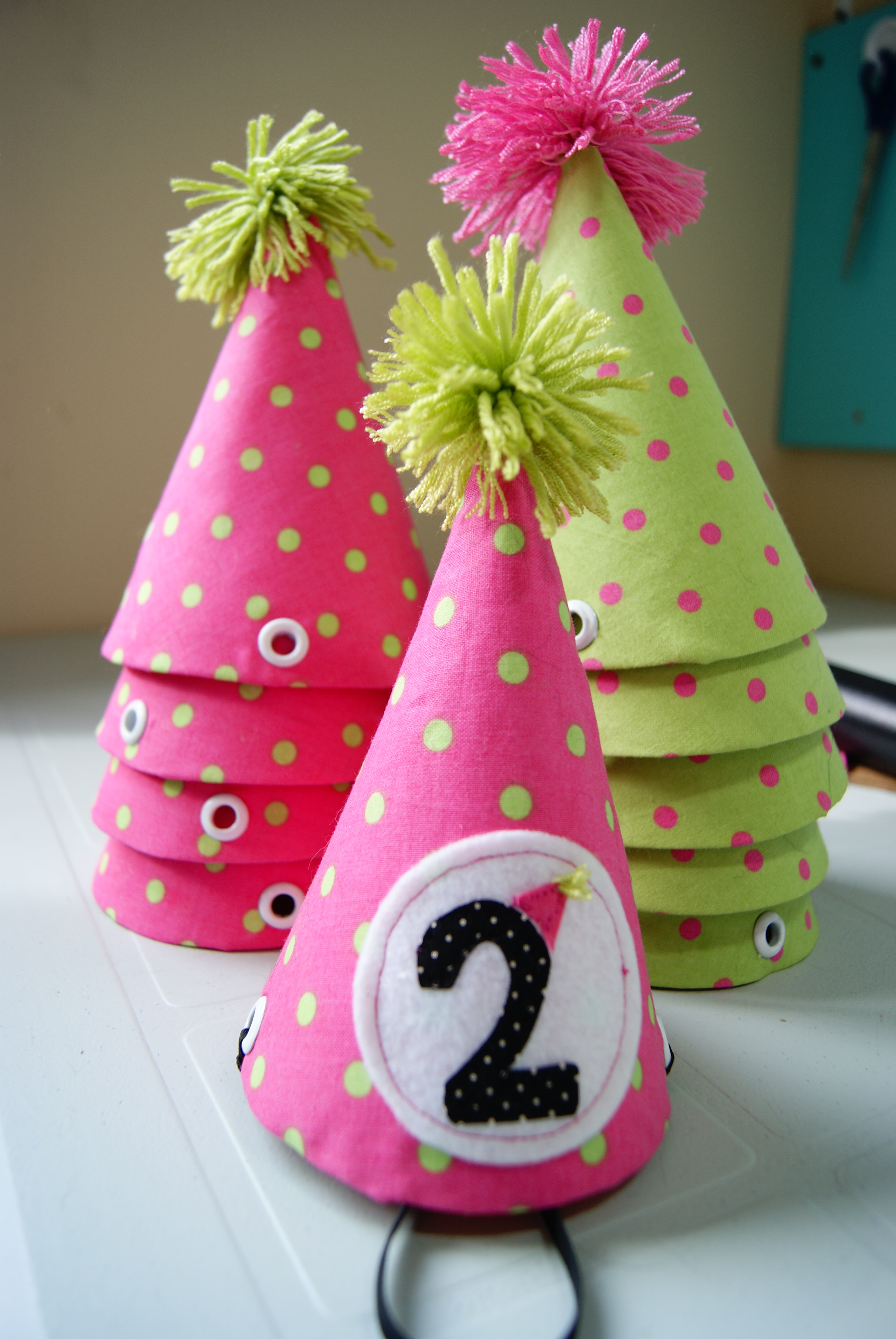 These quarantine inspired party hats are decorated with mask, toilet paper, and virus details and are topp. Show Tell Birthday Bunting Banner And Party Hats