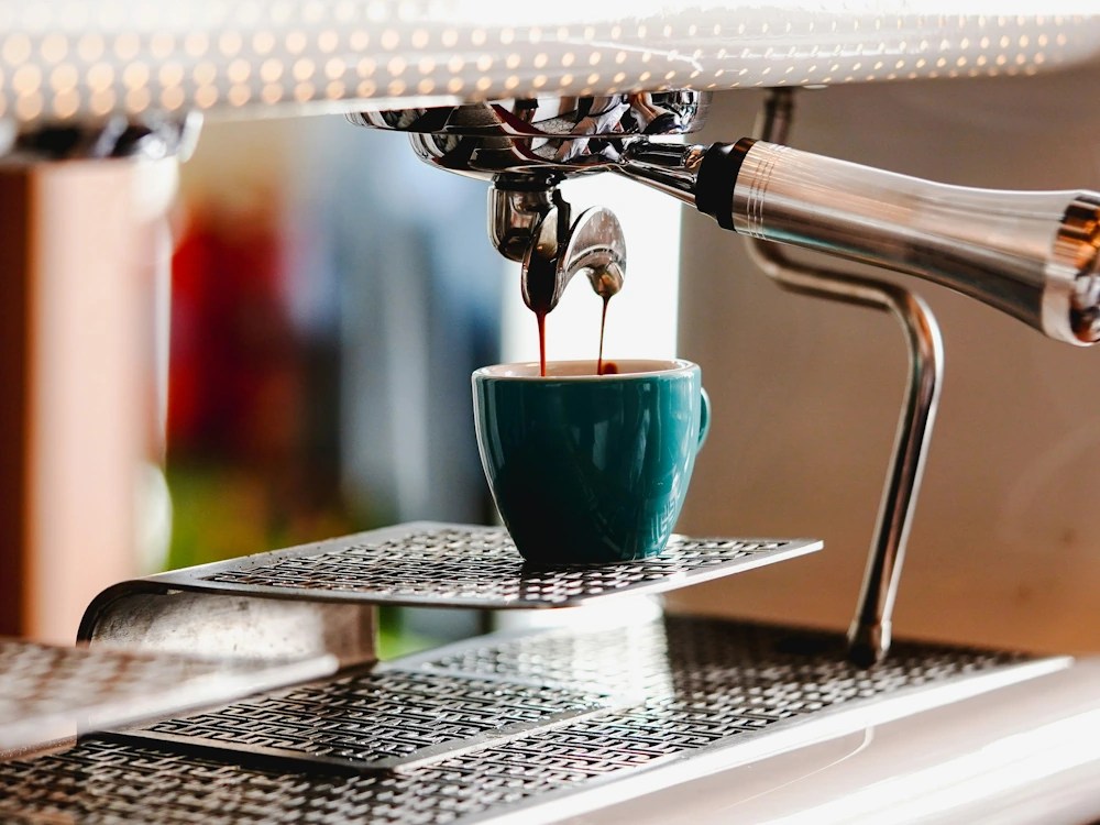- Healthy Brew Hub A double shot of espresso being extracted on a backless machine.