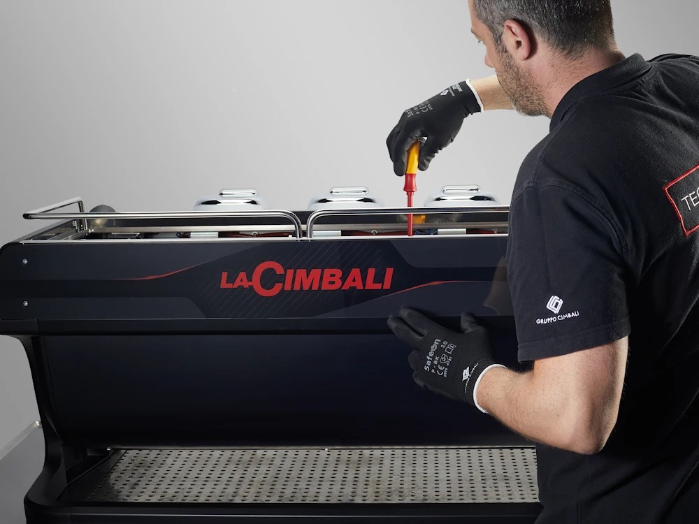 - Healthy Brew Hub Cimbali technician fixes espresso machine.