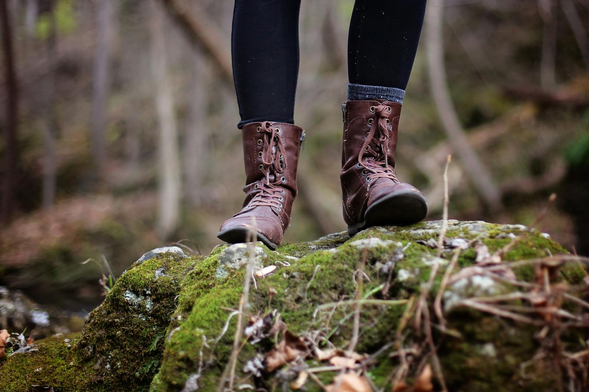 low section of man standing in forest