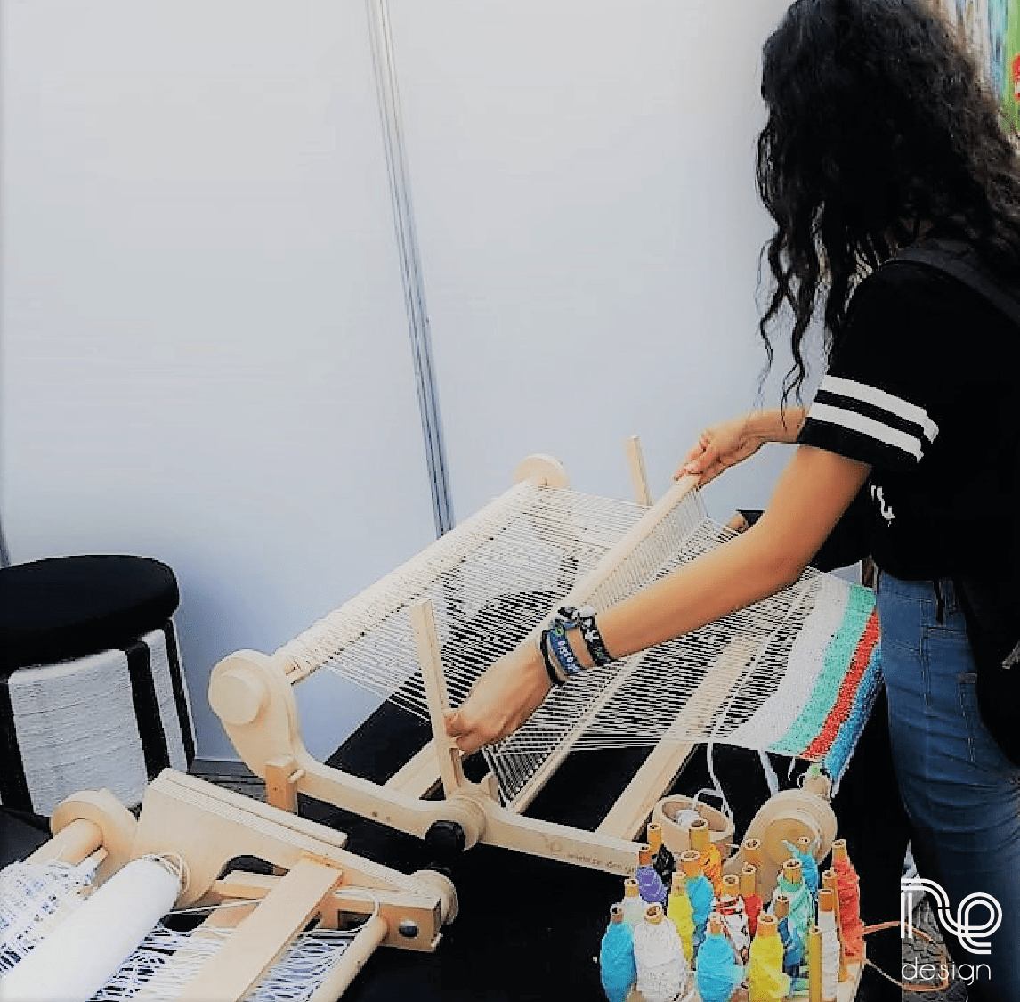 Participants trying out weaving Plastex on our Kompakt Loom