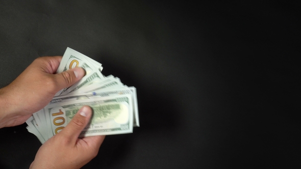 We offer all types of picture frames to suit your home and office decor, such as traditional wood picture frames and contemporary metal frames. A Man Counts Money With His Hands On A Black Background By Sibcam Videohive