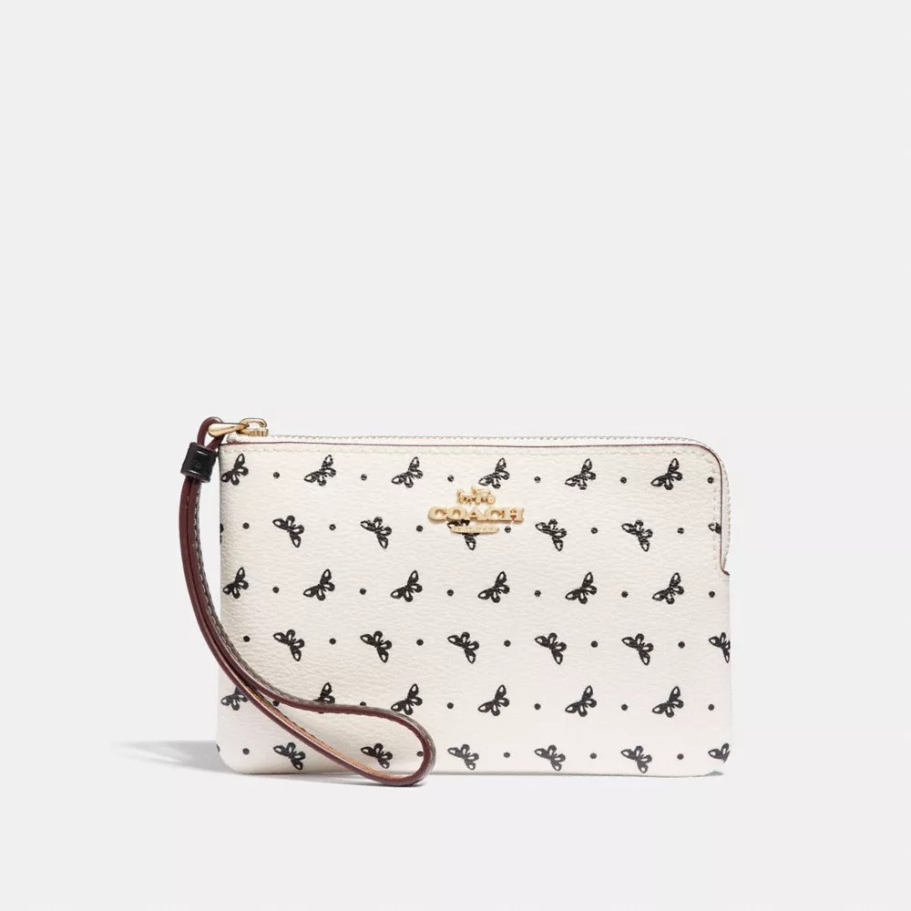 Branded dust bags and boxes are not available. Coach F31244 Corner Zip Wristlet With Butterfly Dot Print Chalk Black Light Gold Coach Clearance