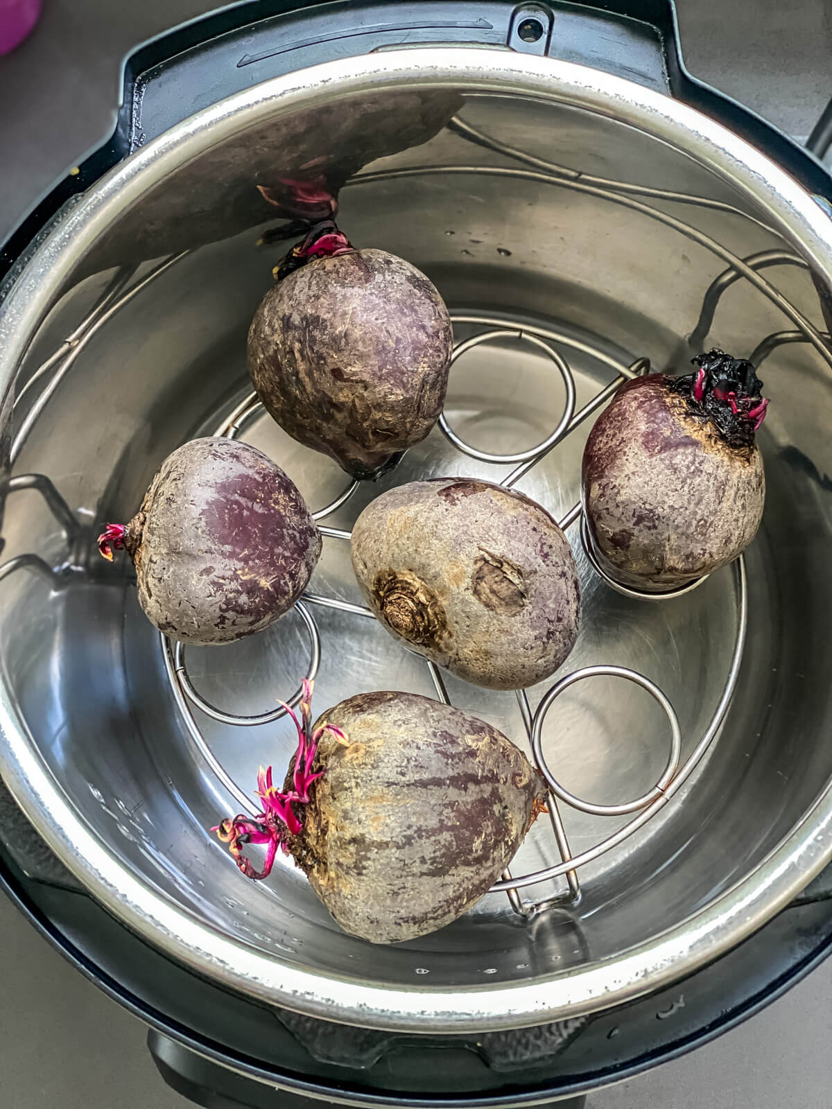 Beets on the trivet in the instant pot.