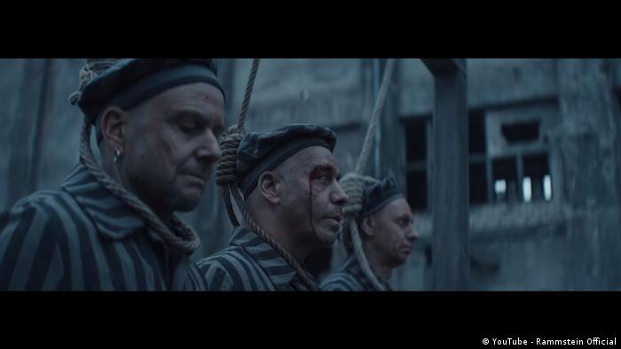 The band members, dressed in the clothes of prisoners at a world war. Rammstein Video Furore Far Right Clickbait Or Anti Fascist Art Music Dw 29 03 2019