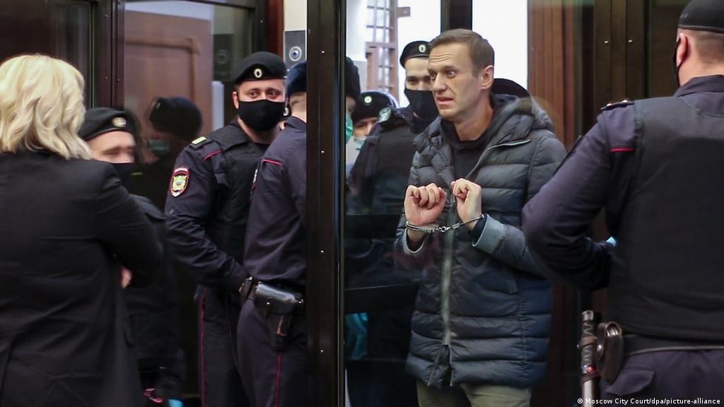 A mask of russian opposition leader alexei navalny is held at a rally in berlin. Russian Opposition Leader Alexei Navalny Sentenced To Prison News Dw 02 02 2021