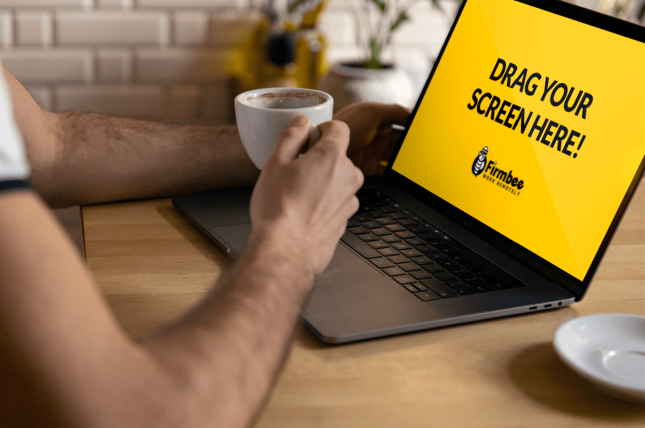 We prepared a free macbook pro mockup near coffee cup. Man Drinks Coffee While Working On Apple Macbook Firmbee