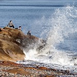 Local kids braving the big waves 4