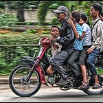 Six on a motorbike.... Phnom Penh, Cambodia