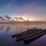 Calm sunrise at Sembawang Beach with Kit Kat bar