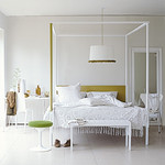 white bedroom with yellow and green
