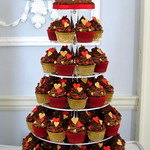 Chocolate buttercream cake with cupcake tower